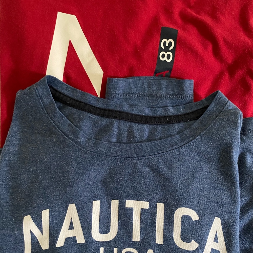 Two long sleeve, Nautica shirts, one red, one blue size small.